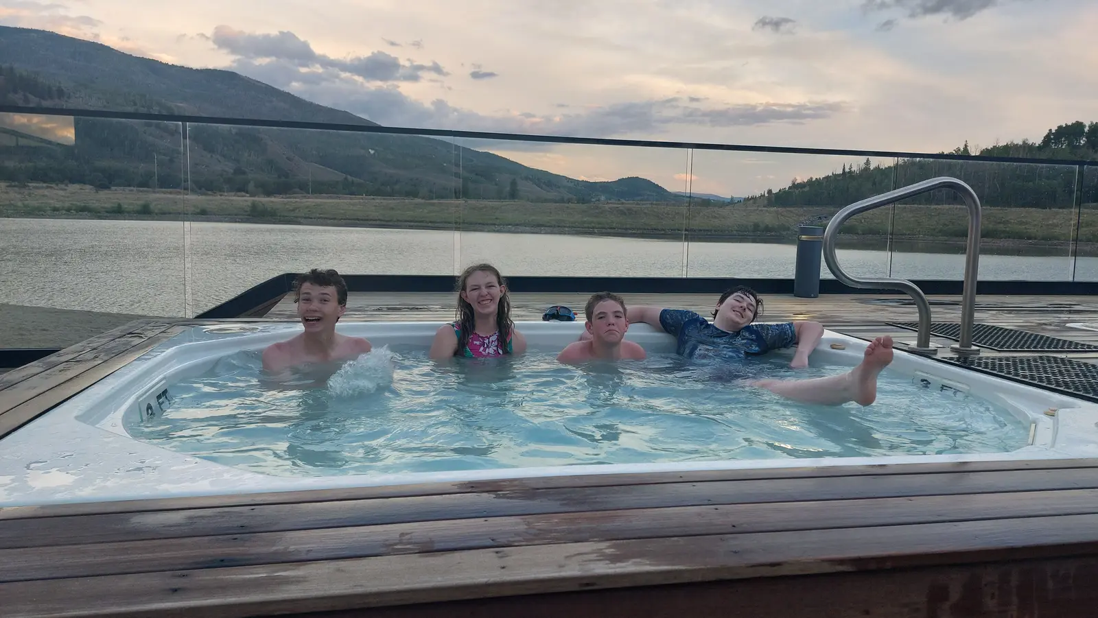 Hot tub with a mountain-lake view